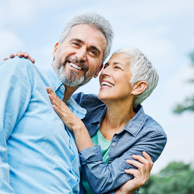 elderly couple smiling