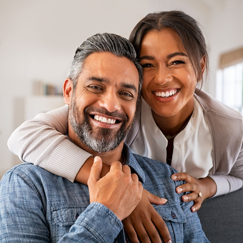 couple smiling on couch