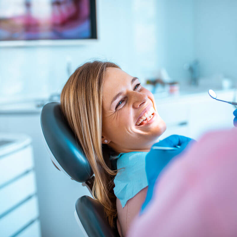 lady in dentist chair smiling