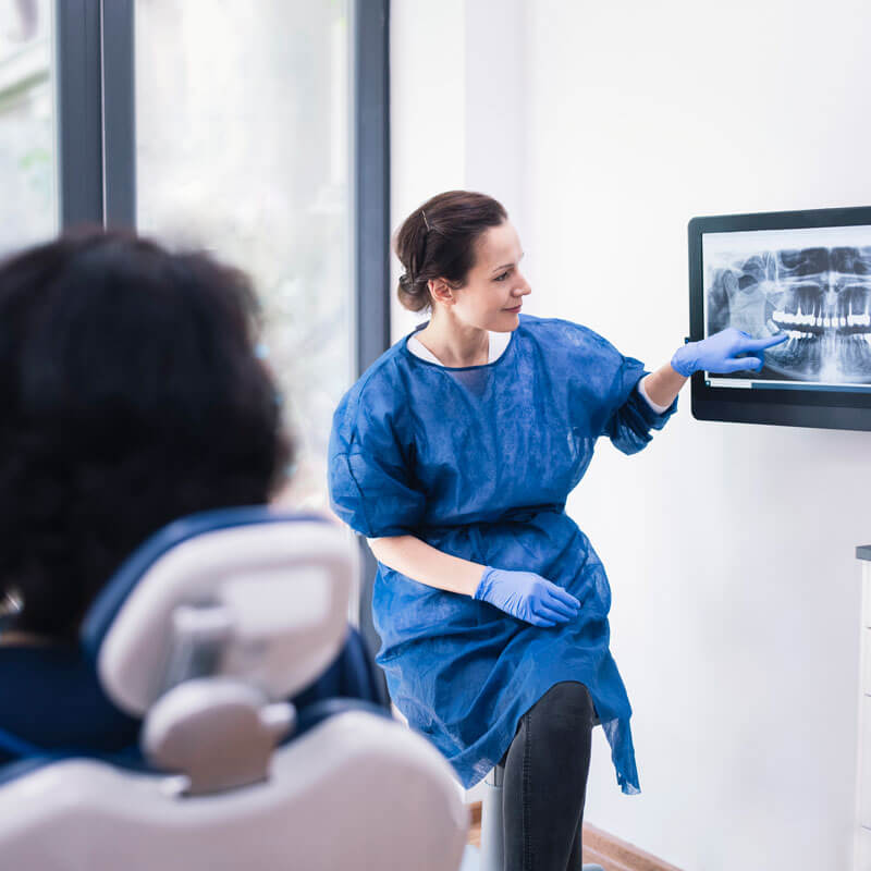 doctor showing patient xrays